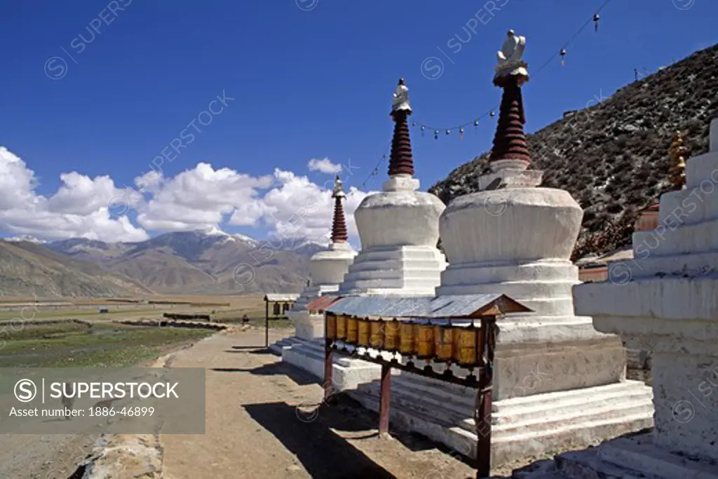 STUPAS & PRAYER WHEELS outside KATSEL TEMPLE a Demoness subduing Temple built by Songtsen Gampo - CENTRAL TIBET