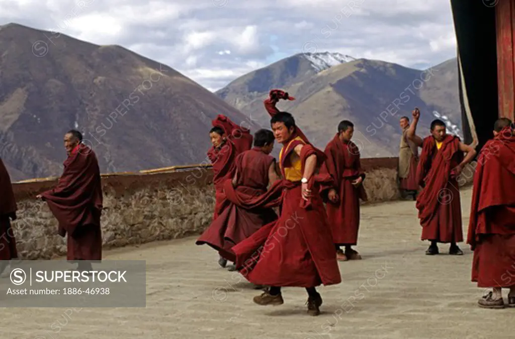 MONKS of the KAGYU SECT of TIBETAN BUDDHISM practice their ceremonial dances at DRIGUNG MONASTERY  - TIBET