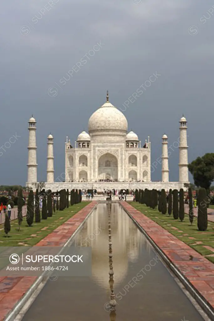 Reflection of  Taj Mahal in pond Seventh Wonders of World on the south bank of Yamuna river ; Agra ; Uttar Pradesh ; India UNESCO World Heritage Site