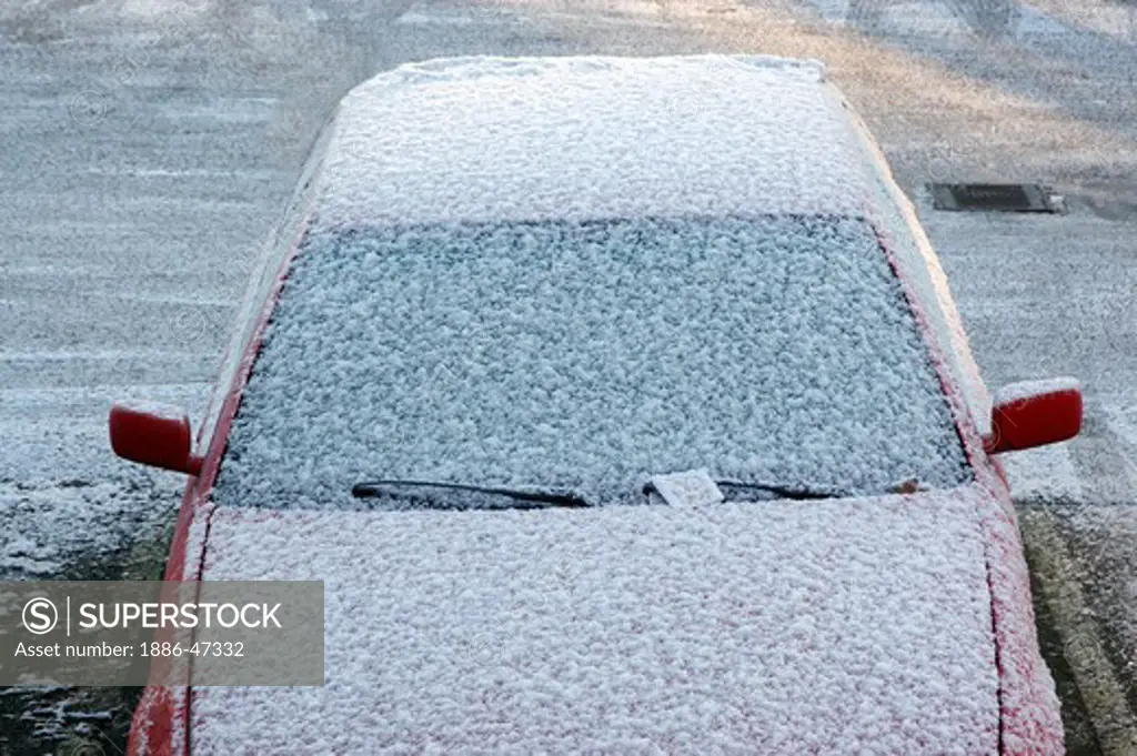 Snow and frost on parked car during winter in Gothenburg, Sweden