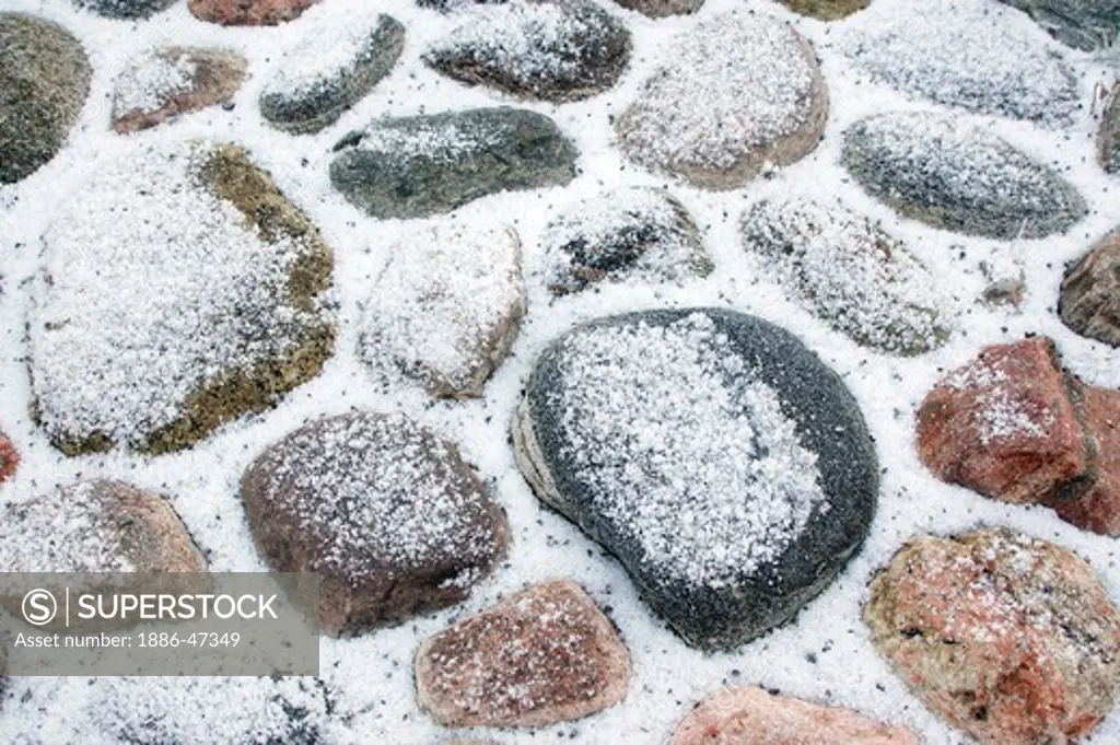 Snow and winter frost deposited on stones during winter in Sweden