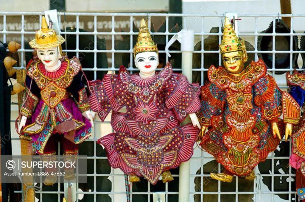 Dolls with traditional Thai costumes on sale at Buddha temple site Bangkok ; Thailand ; South East Asia