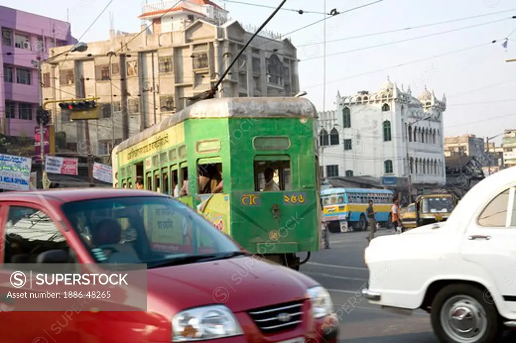 Tram in old way of commuting service traffic on road ; Calcutta now Kolkata ; West Bengal ; India