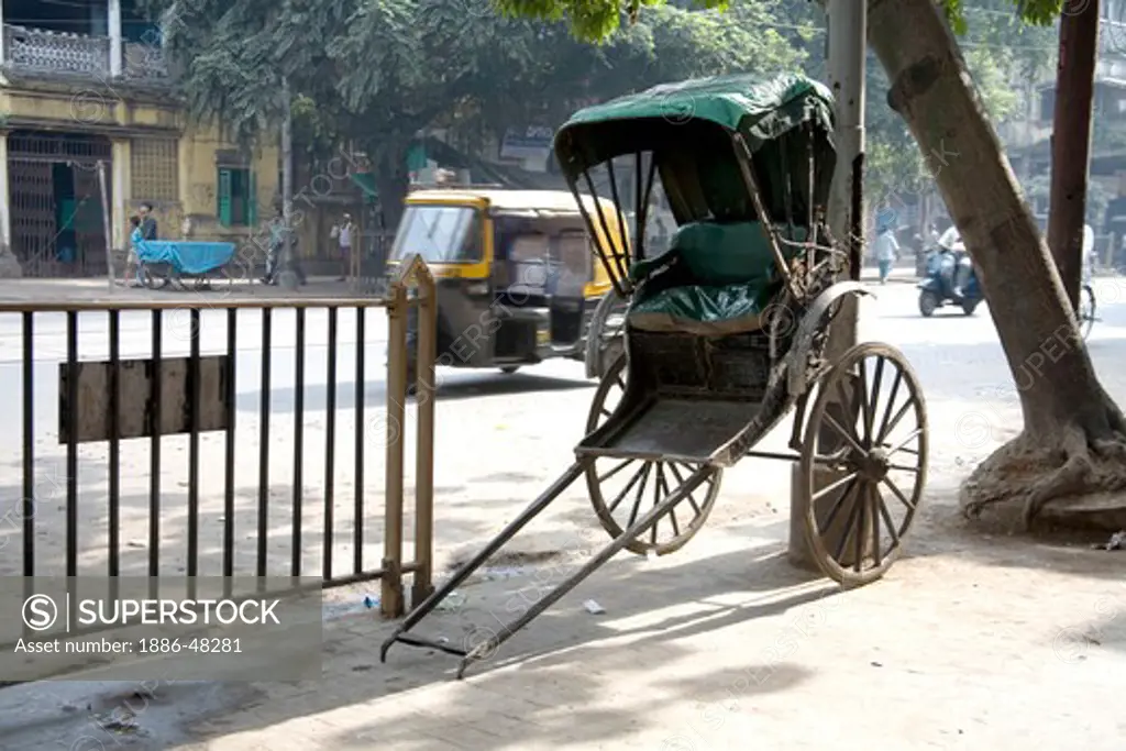 Empty hand rickshaw and auto rickshaw ; Calcutta now Kolkata ; West Bengal ; India