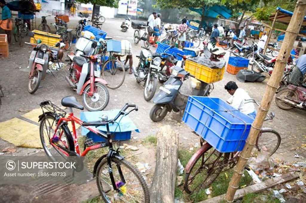 Two wheelers and bicycle parked near fish market ; Cochin now Kochi ; Kerala ; India