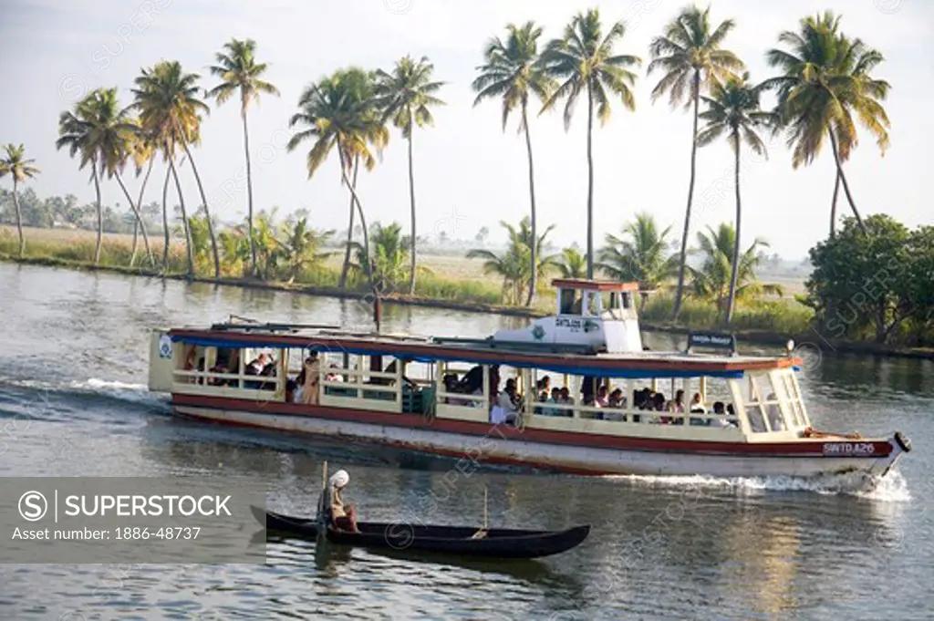 Tourists traveling in ferryboat in Backwaters ; Alleppey ; Kerala ; India