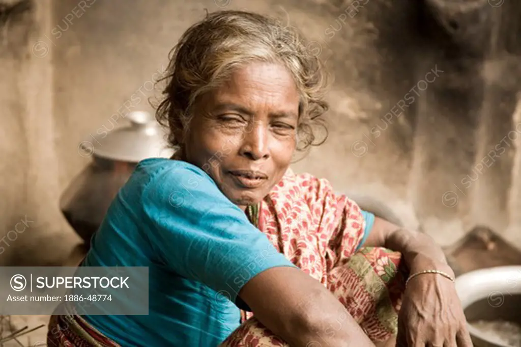 Old lady in kitchen ; village Tauta; district Manikgunj ; Bangladesh