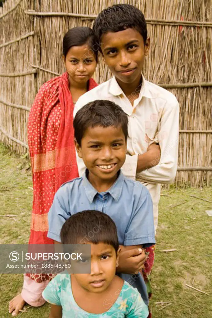 Boys and girls posing for pictures ; village Tauta; district Manikgunj ; Bangladesh