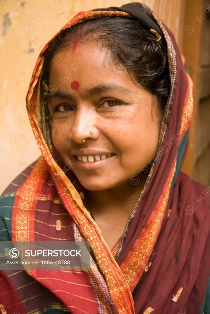 42 years old Bengali married female red dot on forehead ; village Tauta ; District Manikgunj ; Bangladesh