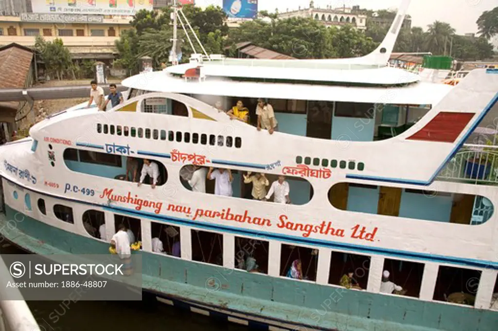 People traveling in cruise boat in Burigunga Buri Gunga River ; Sadarghat Boat terminal ; Dhaka ; Bangladesh