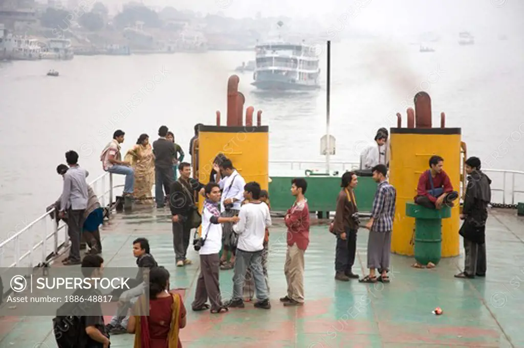 People traveling in Cruise boat in Burigunga Buri Gunga River ; Sadarghat Boat terminal ; Dhaka ; Bangladesh