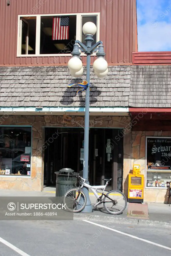 Bicycle in downtown ; Seward ; Kenai peninsula borough ;  Alaska ; U.S.A. United States of America