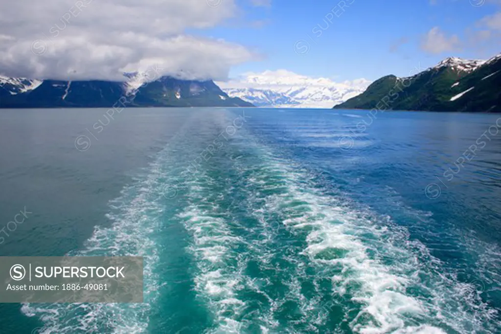 Distance view of Hubbard glacier; waves created by cruise ship ; the longest tidewater glacier in Alaska; Saint Elias  national park ; disenchantment bay ; Alaska ; U.S.A. United States of America