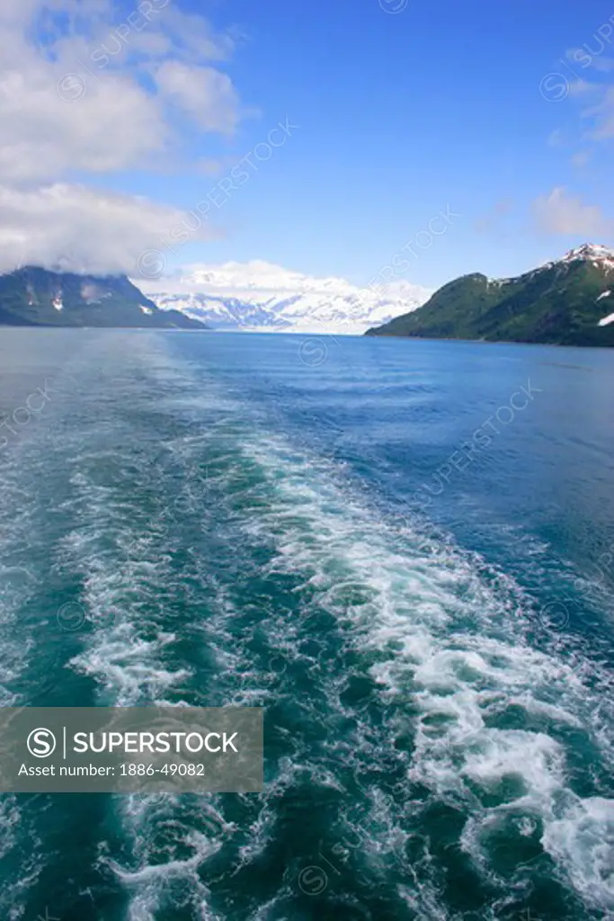 Distance view of Hubbard glacier; waves created by cruise ship ; the longest tidewater glacier in Alaska; Saint Elias  national park ; disenchantment bay ; Alaska ; U.S.A. United States of America