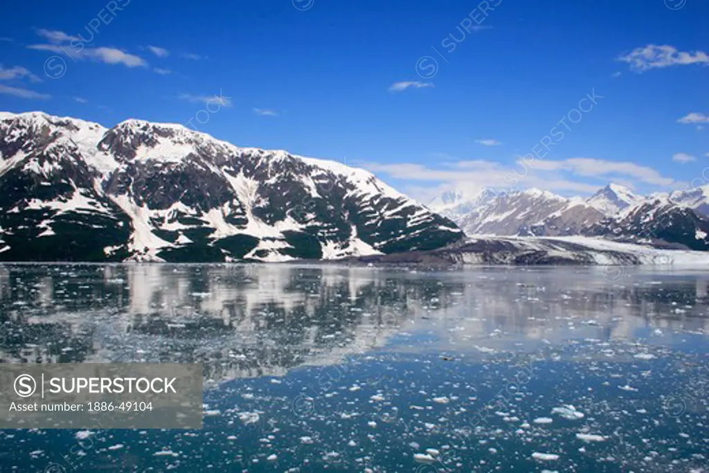 Icebergs with Hubbard glacier and saint Elias mountain ;  The longest tidewater glacier in Alaska ; Saint Elias  national park ; Disenchantment bay ; Alaska ; U.S.A. United States of America