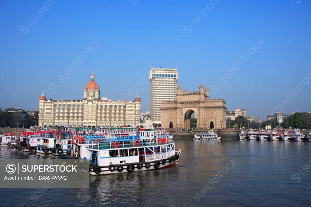 Gateway of India and Taj Mahal Hotel ; ferryboats in sea ; Bombay Mumbai ; Maharashtra ; India