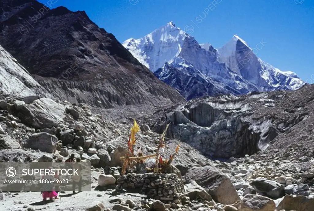 Bengali pilgrims approach the temple to the Ganga at the source  Gaumukh or Cows Mouth with the Bhagirathi peaks in the background; Gangotri valley; Garhwal; Uttaranchal; India