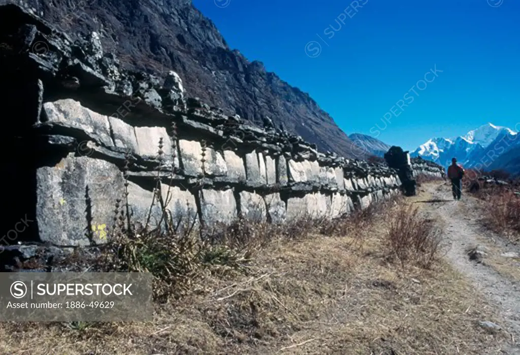 One of the longest mani  prayer walls in the world near Langtang village in the Langtang valley; Nepal