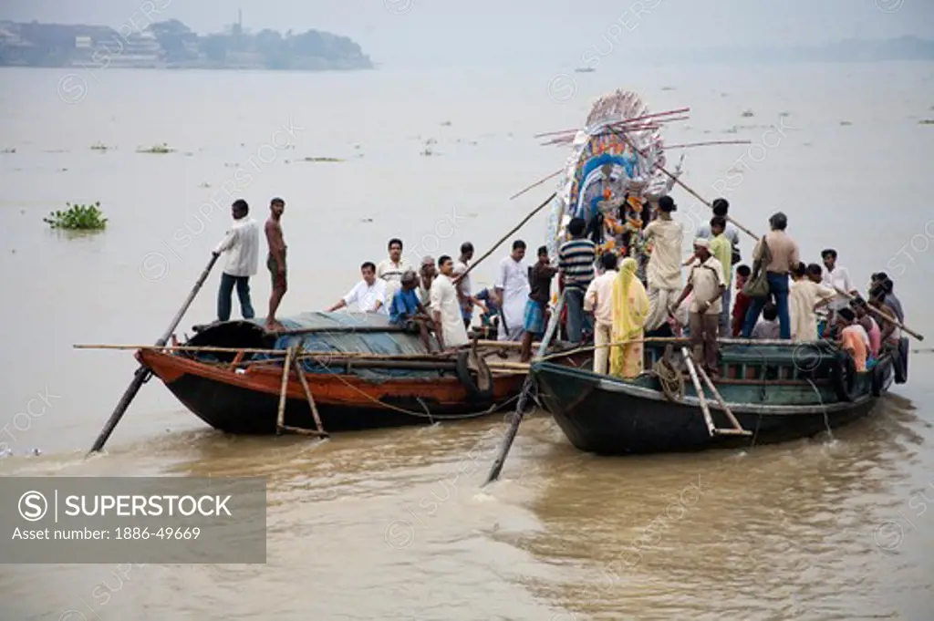 Farewell of the Durga Idol in Hooghly river ; Visarjan ; Durga Pooja Dussera Vijayadasami Navaratri Festival ; Shakti Thakur ; Bag Bazar ; Calcutta Kolkata ; West Bengal ; India