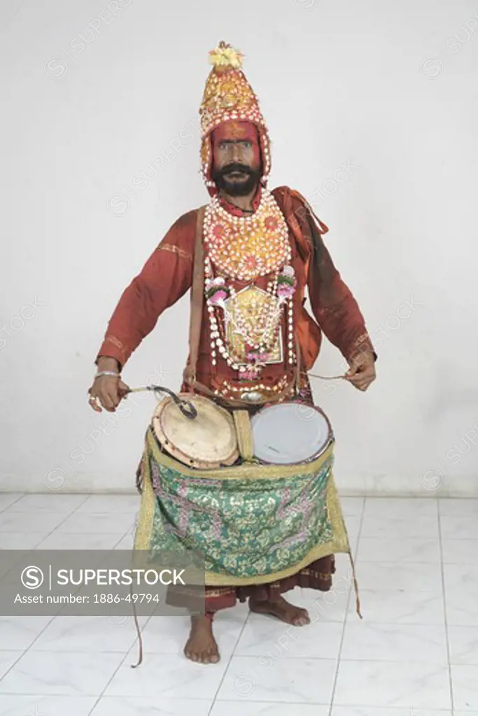 Gondhali from Solapur District  playing drums ; Maharashtra ; India MR#687Z