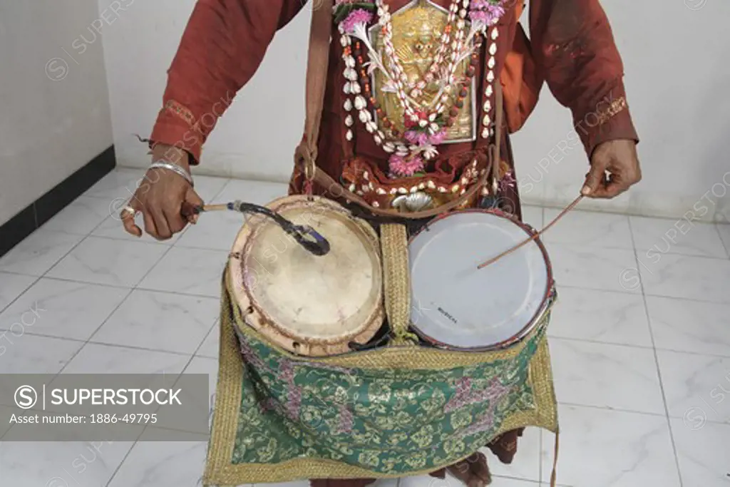 Gondhali from Solapur District  playing drums ; Maharashtra ; India