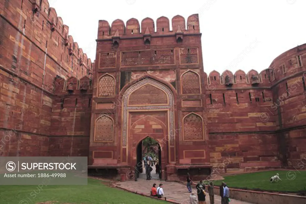 Tourists at Agra fort built in 16th century by Mughal emperor made by red sand stone on west bank of the Yamuna River ; Agra ; Uttar Pradesh ; India UNESCO World Heritage Site