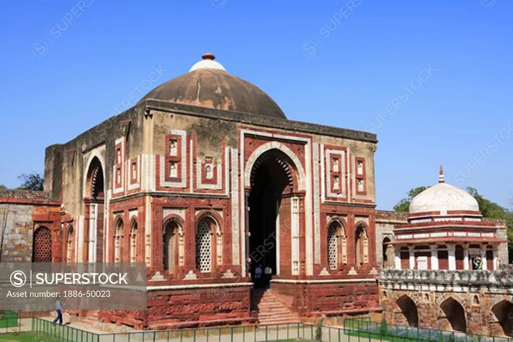 Alai Darwaza and Imam Zamin's tomb in Qutab Minar complex built in 1311 red sandstone ; Indo-Muslim art ; Delhi sultanate ; Delhi; India UNESCO World Heritage Site