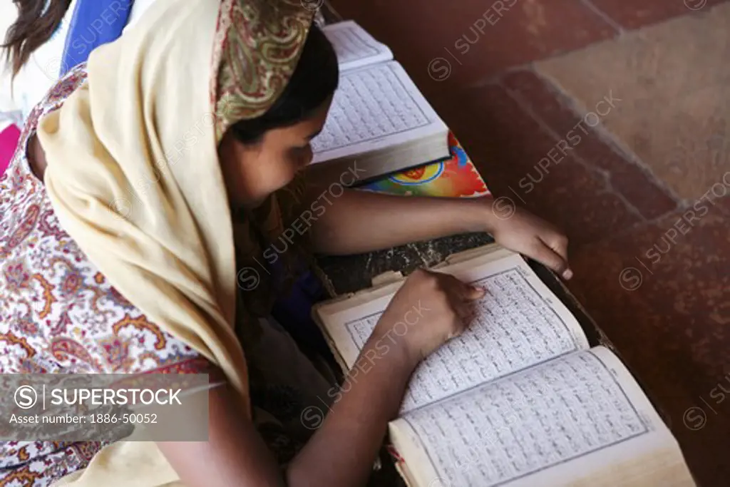 Student studying in Urdu Muslim School classroom Madarasa in Jami Masjid in Fatehpur Sikri built during second half of 16th century ; Agra; Uttar Pradesh ; India UNESCO World Heritage Site