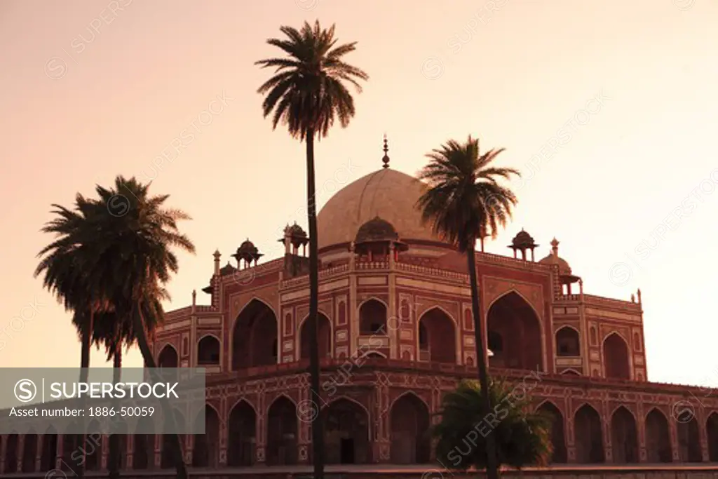 Evening view of Humayun's tomb built in 1570 made from red sandstone and white marble first garden-tomb on Indian subcontinent persian influence in mughal architecture ; Delhi; India UNESCO World Heritage Site