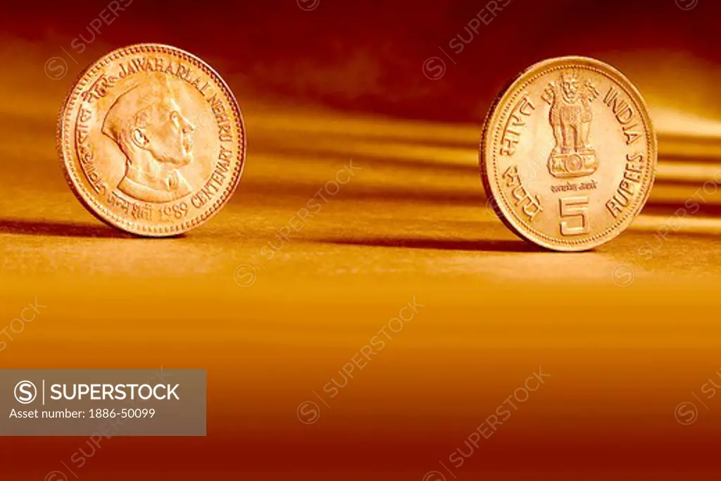 Double pair Indian currency five rupees coin front side and backside manner embossed Jawaharlal Nehru centenary 1989 on orange background