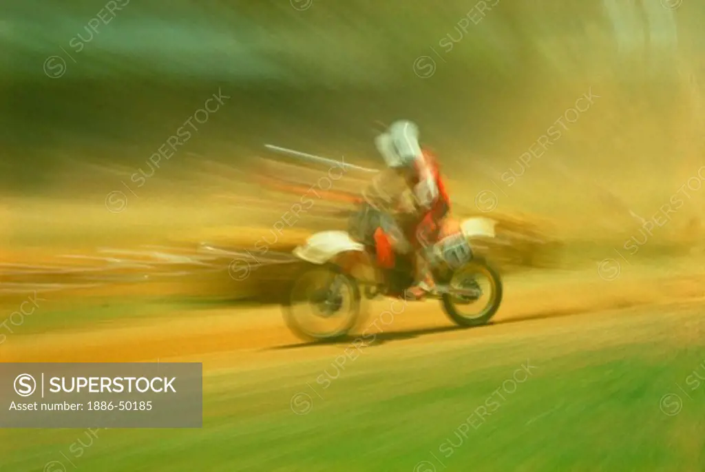 Motor cycle racing in motion.