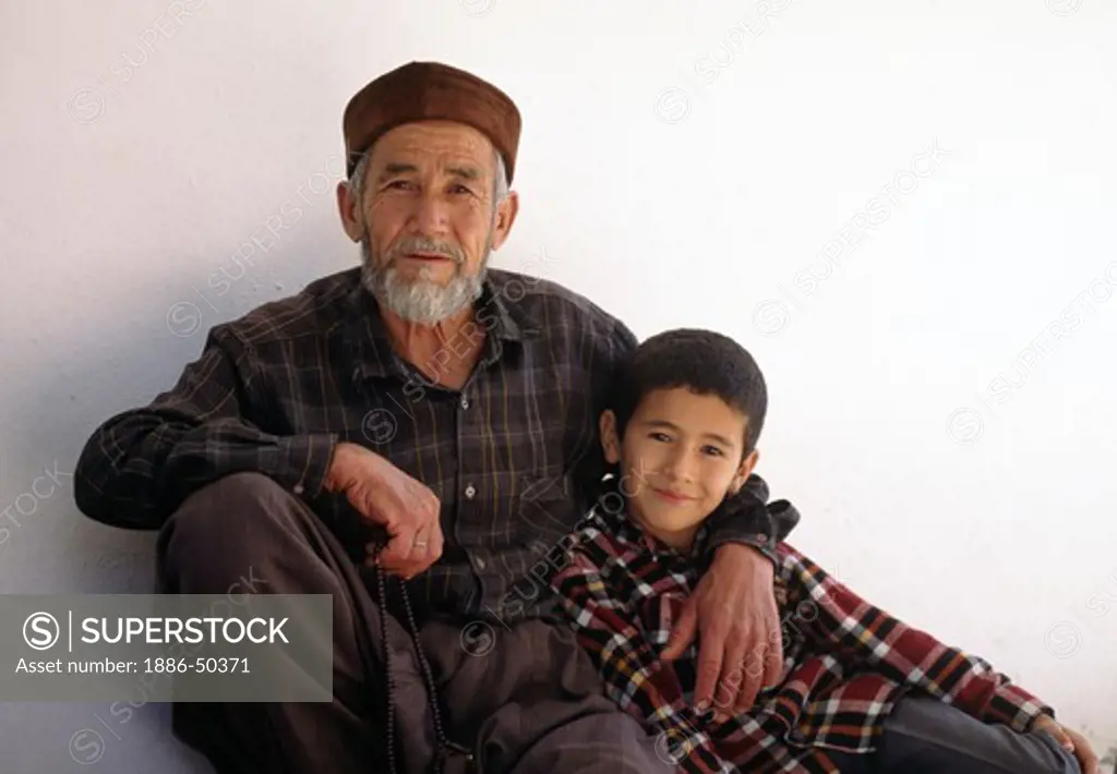 Portrait of grandfather and grandson in the village of Bezirgan, Turkey.