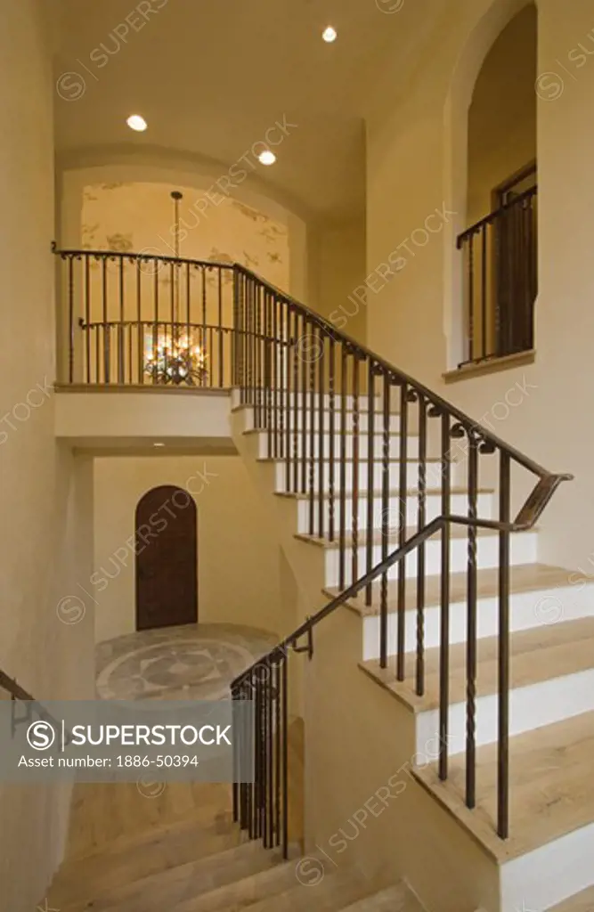 STAIRWAY made of hardwood and wrought iron railing with STONE FLOOR on the bottom floor - CALIFORNIA LUXURY HOME
