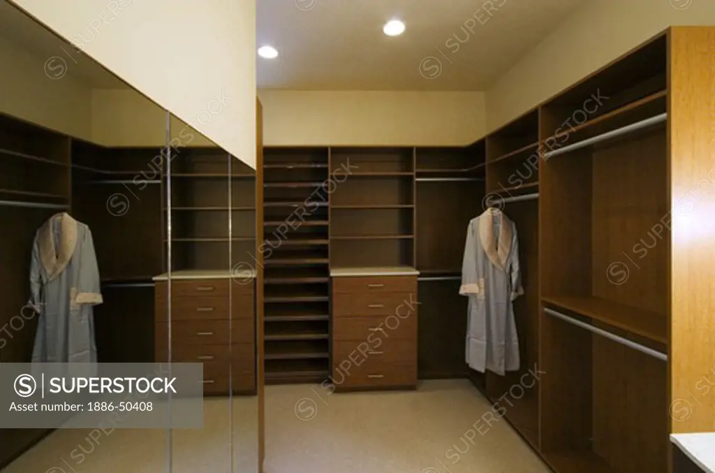 Large walk in DRESSING ROOM with build in wooden closets in a CALIFORNIA LUXURY HOME