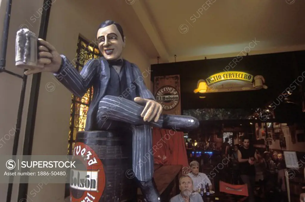 BEER DRINKING STATUE welcomes customers in a BAR in barrio SAN TELMO - BUENOS AIRES, ARGENTINA
