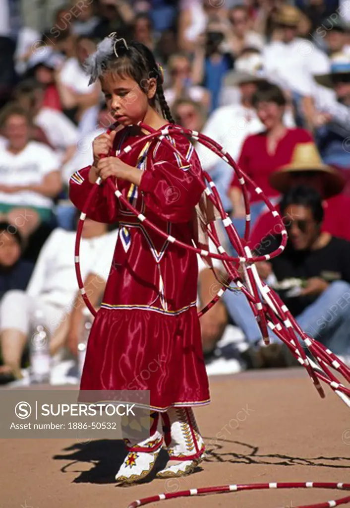 A NATIVE AMERICAN girl competes at the WORLD CHAMPIONSHIP HOOP DANCE CONTEST - PHOENIX, ARIZONA