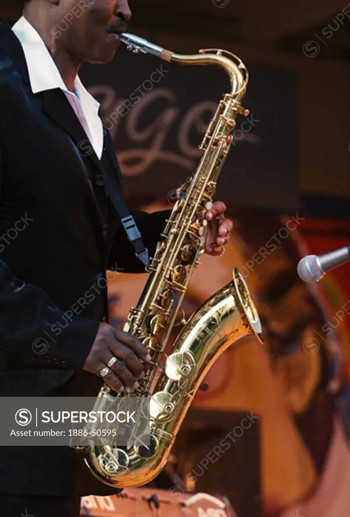 SAXOPHONIST Julien Vaught preforms with the J C SMITH BAND at the MONTEREY BAY BLUES FESTIVAL - MONTEREY, CALIFORNIA