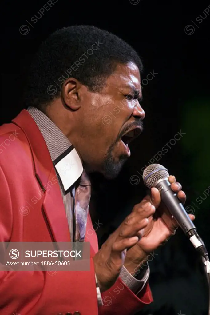 African American man sings during a tribute to Ray Charles at the MONTEREY BAY BLUES FESTIVAL - MONTEREY, CALIFORNIA