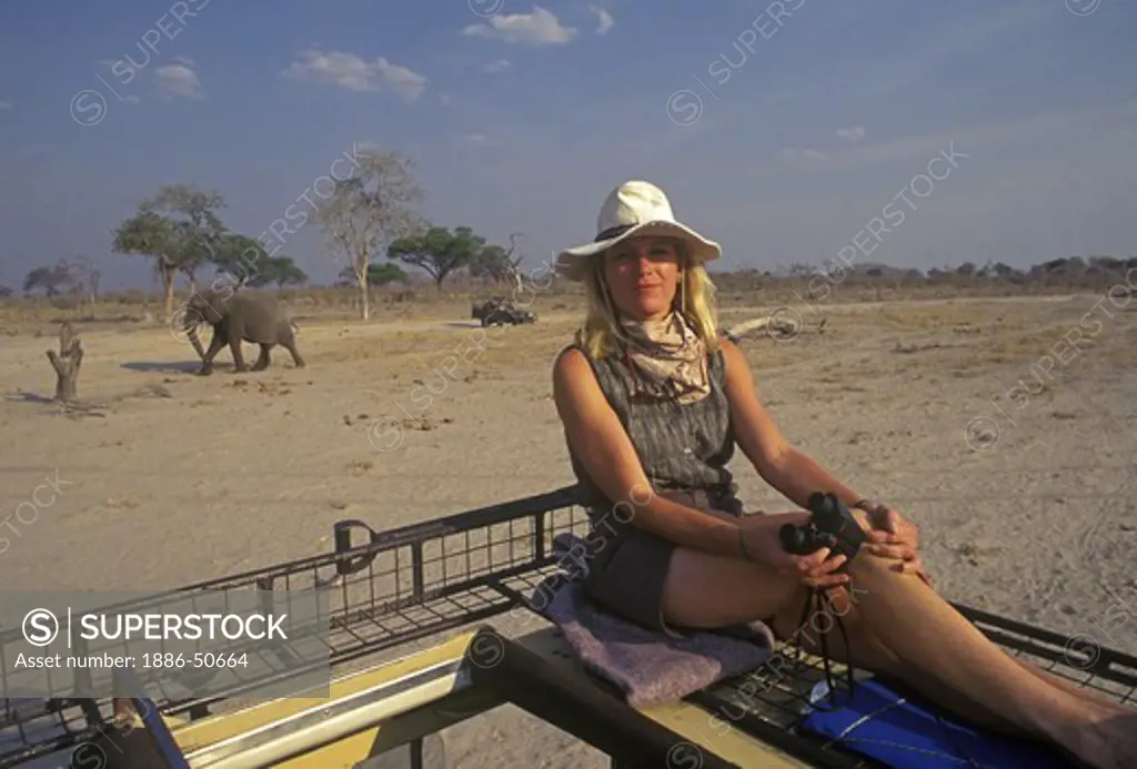 CAROL watches the ELEPHANTS at a watering hole in the SAVUTI MARSH - CHOBE NATIONAL PARK, BOTSWANA