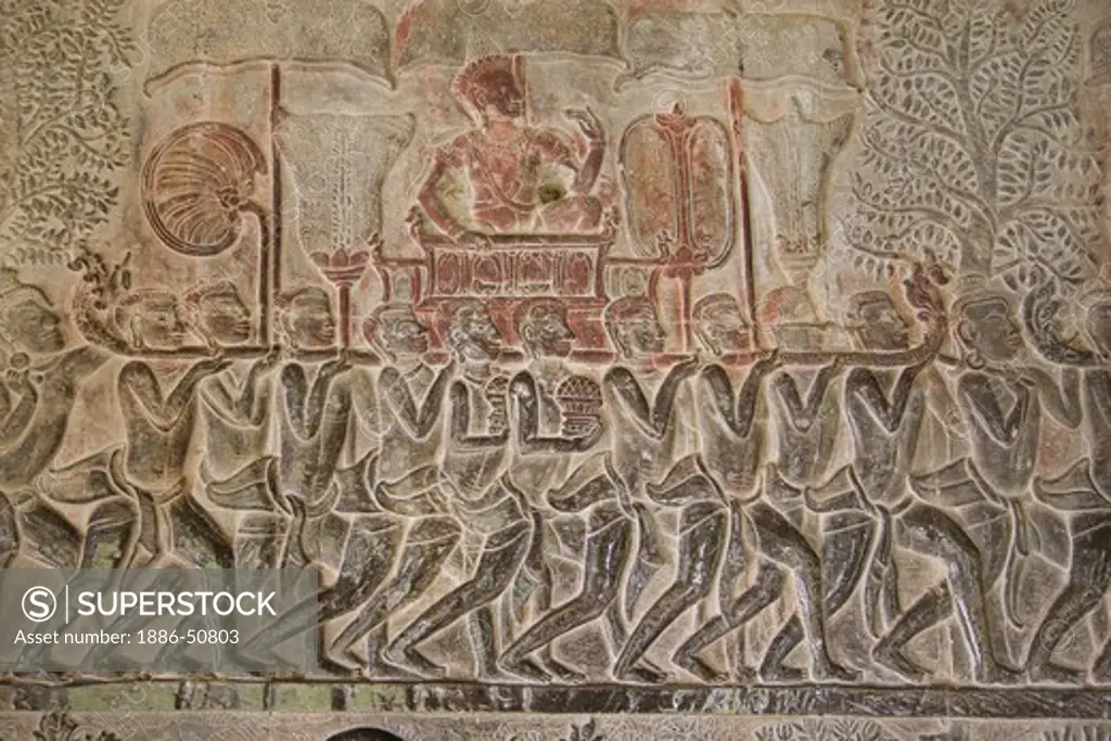 Stone carved bas relief (Northern pavilion of Western Gallery) of a royal procession from the Ramayana at Angkor Wat  -  Cambodia