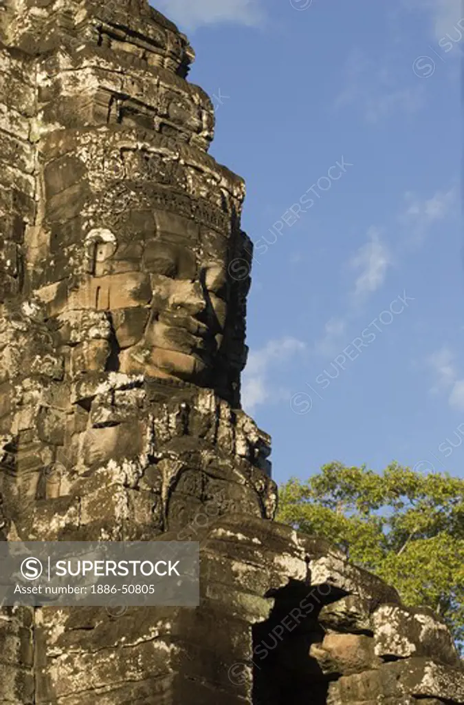 A face tower of The Bayon at Angkor Thom, the largest Khmer city ever built, are part of the Angkor Wat complex  -  Siem Reap, Cambodia
