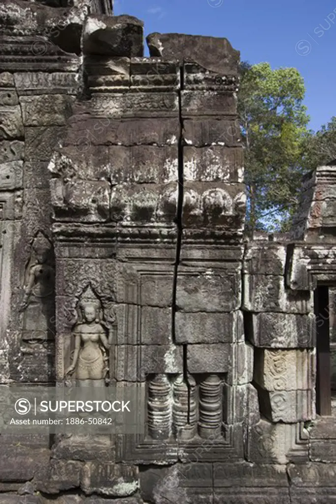 Stone carved bas relief of Apsara (celestial maiden) at Banteay Kdei, built by Jayavarman VII in the Bayon style, part of Angkor Wat - Siem Reap, Cambodia