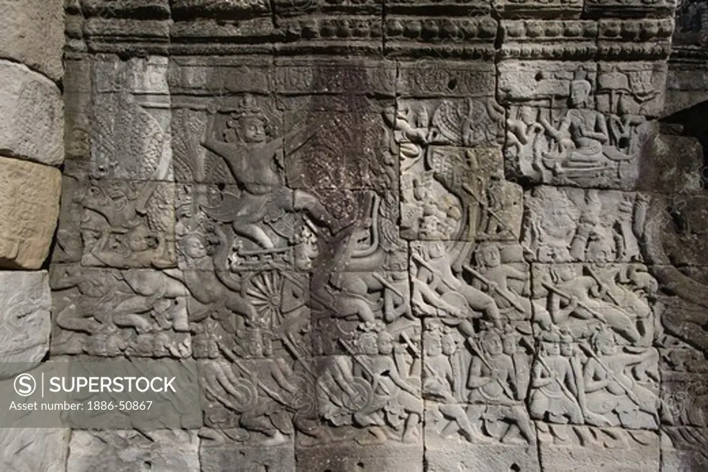 Sandstone bas relief of a historic battle at The Bayon, built by Jayavarman VII, in Angkor Thom  - Angkor Wat, Siem Reap, Cambodia