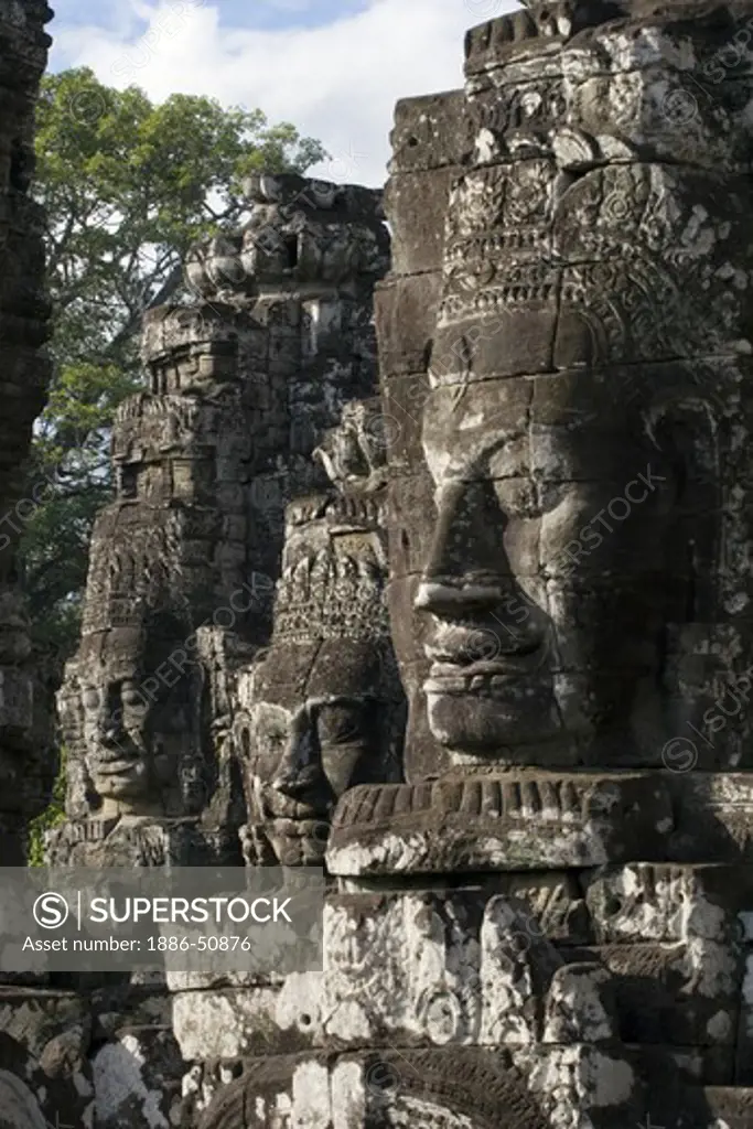 View of three face towers of The Bayon at Angkor Thom, the largest Khmer city ever built, are part of the Angkor Wat complex  -  Siem Reap, Cambodia