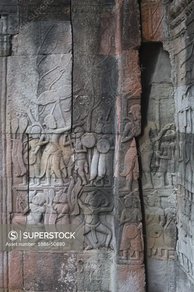 Sandstone bas relief of a historic scene at The Bayon, built by Jayavarman VII, in Angkor Thom  - Angkor Wat, Siem Reap, Cambodia