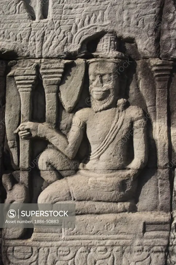Sandstone bas relief of a hermit at The Bayon, built by Jayavarman VII, in Angkor Thom  - Angkor Wat, Siem Reap, Cambodia