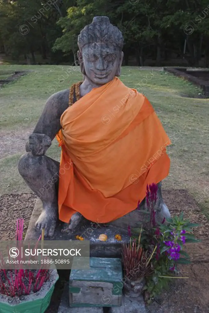 Stone statue of Dhrama or Yama, the god of the underworld atop the Leper King Terrace, part of the Royal Square of Angkor Thom  - Angkor Wat, Siem Reap, Cambodia