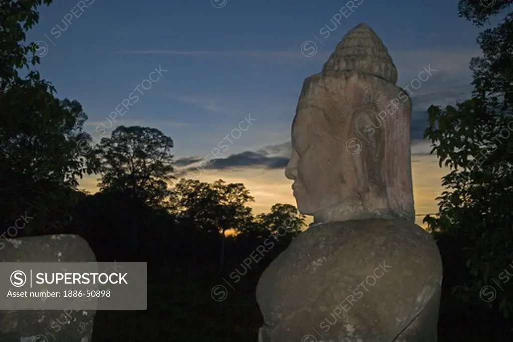 Gods churning the sea of milk hold a naga at the south gate to Angkor Thom  - Angkor Wat, Siem Reap, Cambodia