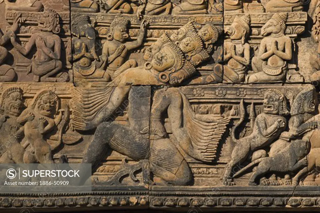 Banteay Srei with bas relief in red sandstone showing Ravana shaking Mount Kailasa (E pediment of S Library), 10th century Khmer  architecture at Angkor Wat -  Siem Reap, Cambodia