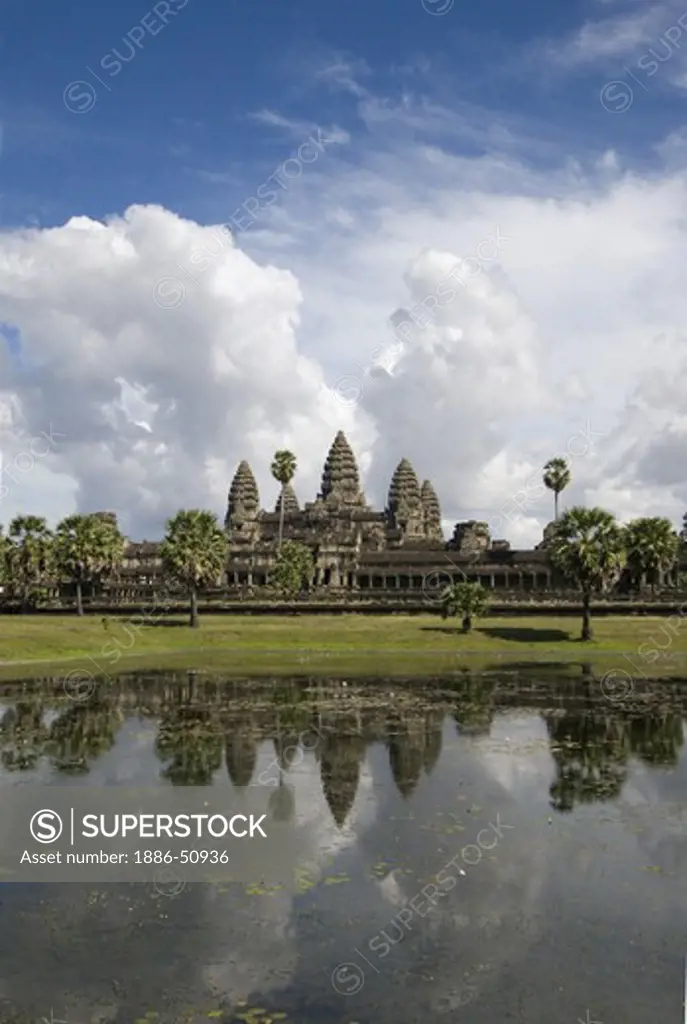Stone temples representing the five peaks of Mount Meru at Angkor Wat & reflection pond, built in the 11th century by Suryavarman the 2nd,  -  Cambodia